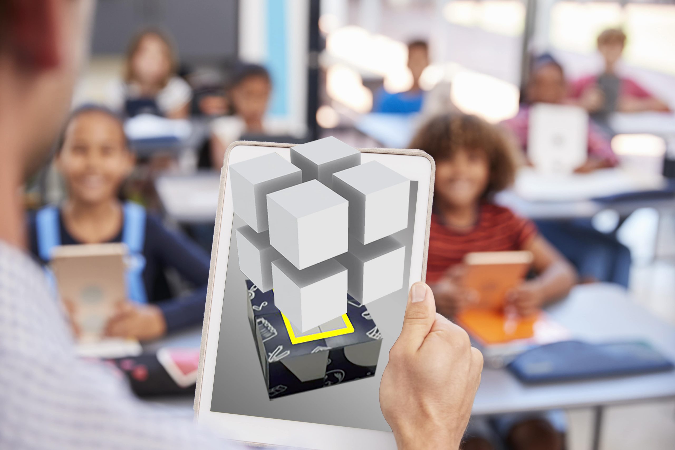 Tablet showing a 3D cube model in Augmented Classroom
